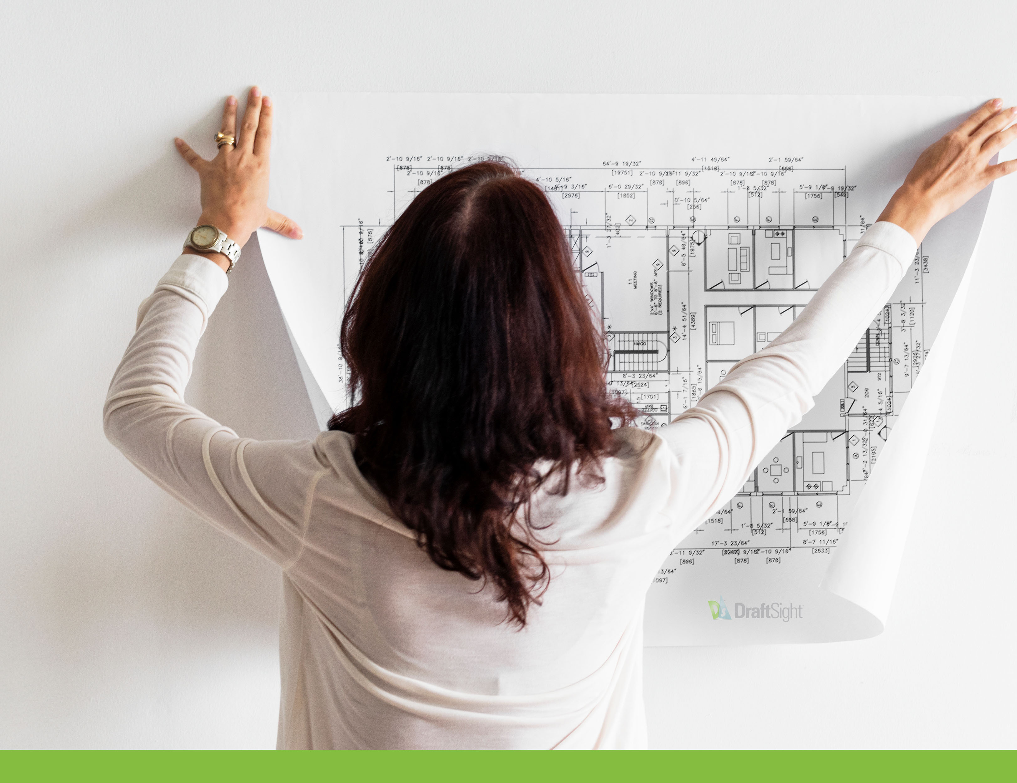 Woman with 2D CAD Drawing on Wall